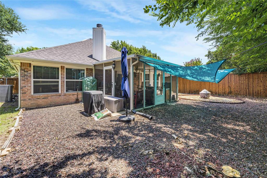 2813 Ridgemere Drive Flower Mound, TX 75028 - Photo 17 of 18 a backyard of a house with yard fire pit and outdoor seating