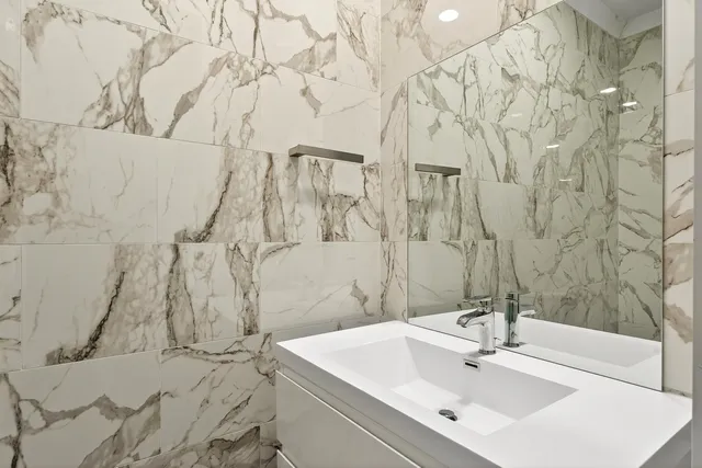 a bathroom with a sink and a mirror