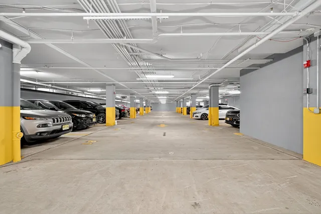 a view of parking garage with cars