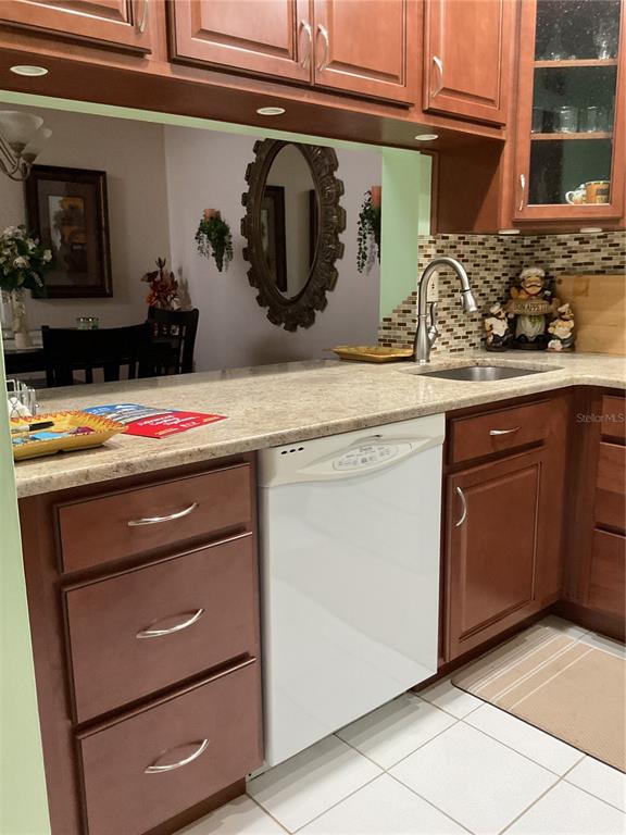 2655 Pine Ridge Way North, Unit D3 Palm Harbor, FL 34684 - Photo 11 of 31 a utility room with sink and washing machine