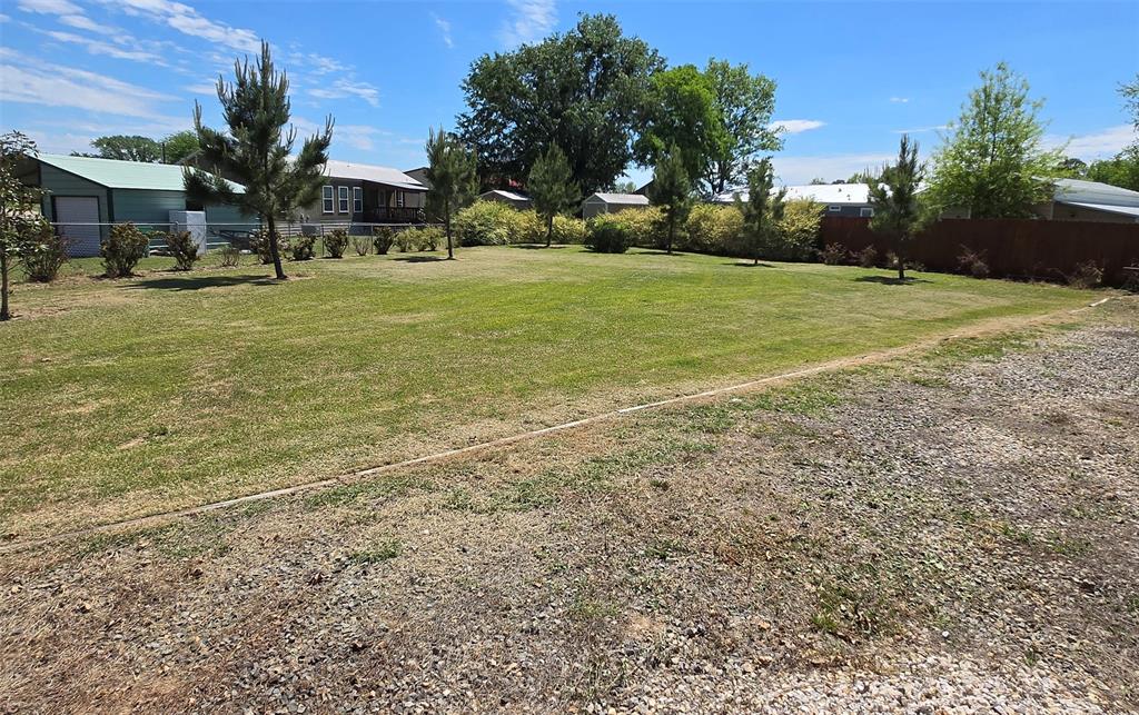 121 Arrowhead Quitman, TX 75783 - Photo 13 of 13 a view of a field with an trees