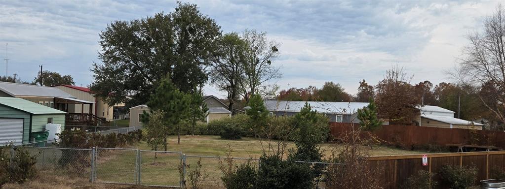 121 Arrowhead Quitman, TX 75783 - Photo 4 of 20 a view of a street with houses