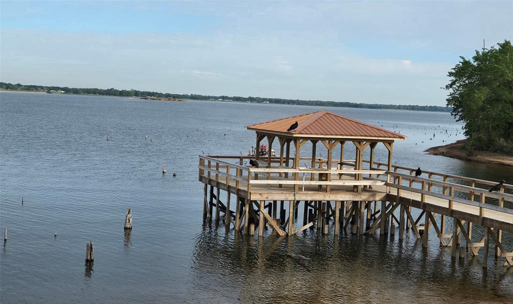 121 Arrowhead Quitman, TX 75783 - Photo 10 of 13 a view of a chairs and table on the terrace