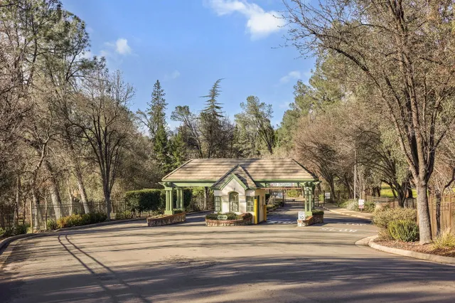 a view of street with houses and trees