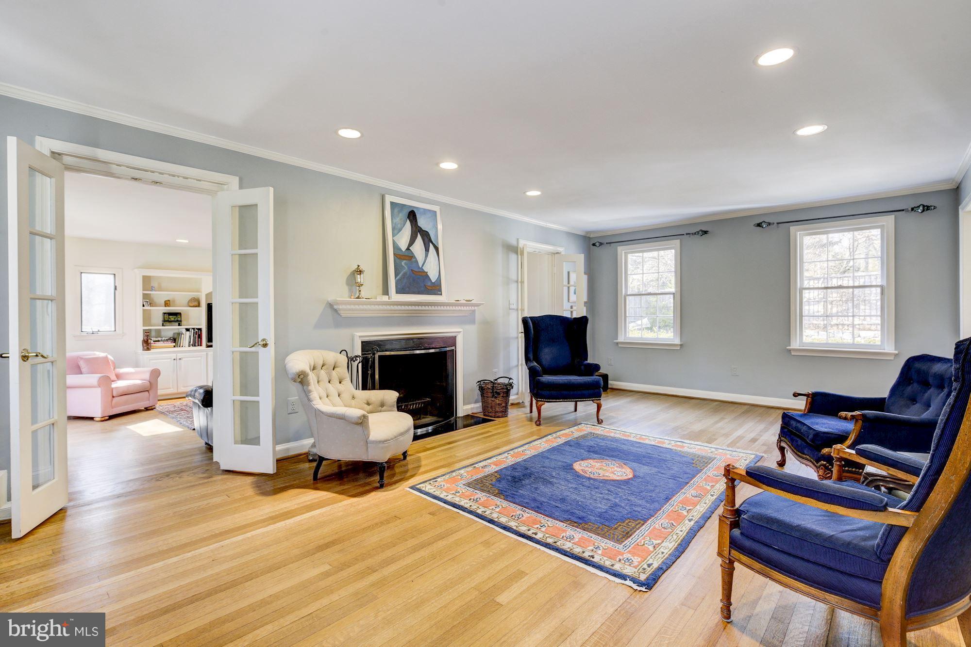 6800 Glenbrook Road Bethesda, MD 20814 - Photo 11 of 30 a living room with furniture a fireplace and window