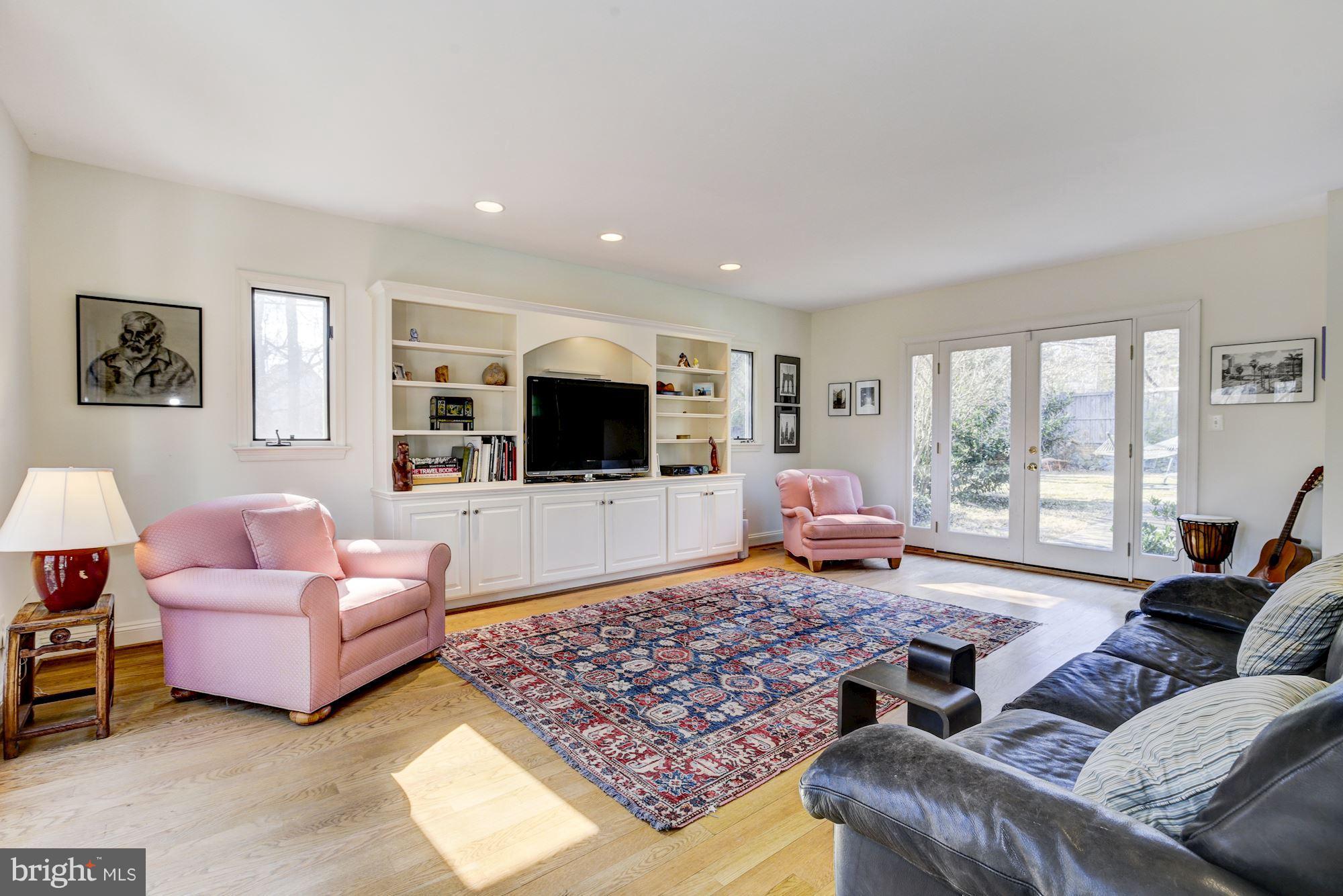 6800 Glenbrook Road Bethesda, MD 20814 - Photo 14 of 30 a living room with furniture and a flat screen tv
