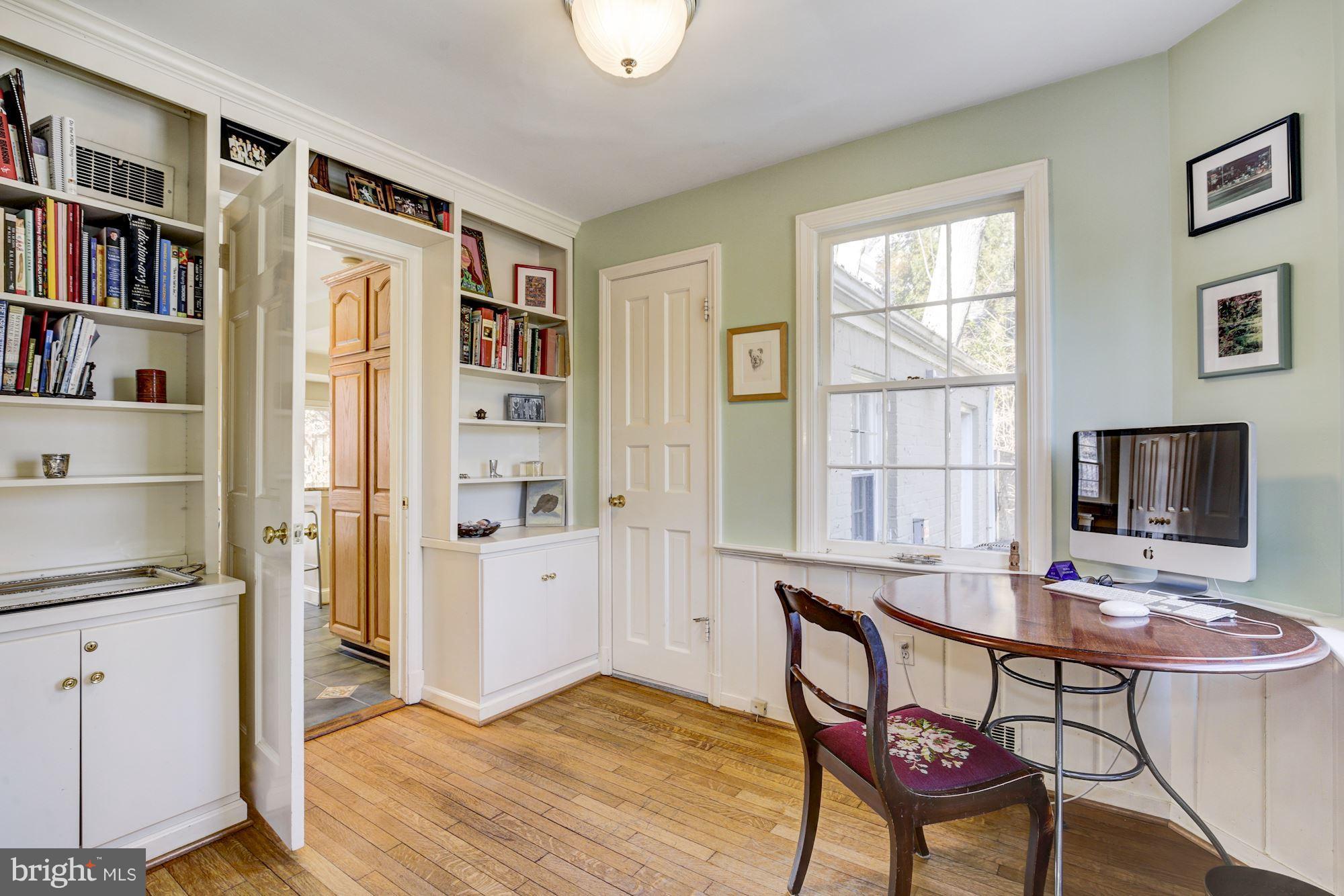 6800 Glenbrook Road Bethesda, MD 20814 - Photo 19 of 30 a workspace with furniture window and wooden floor
