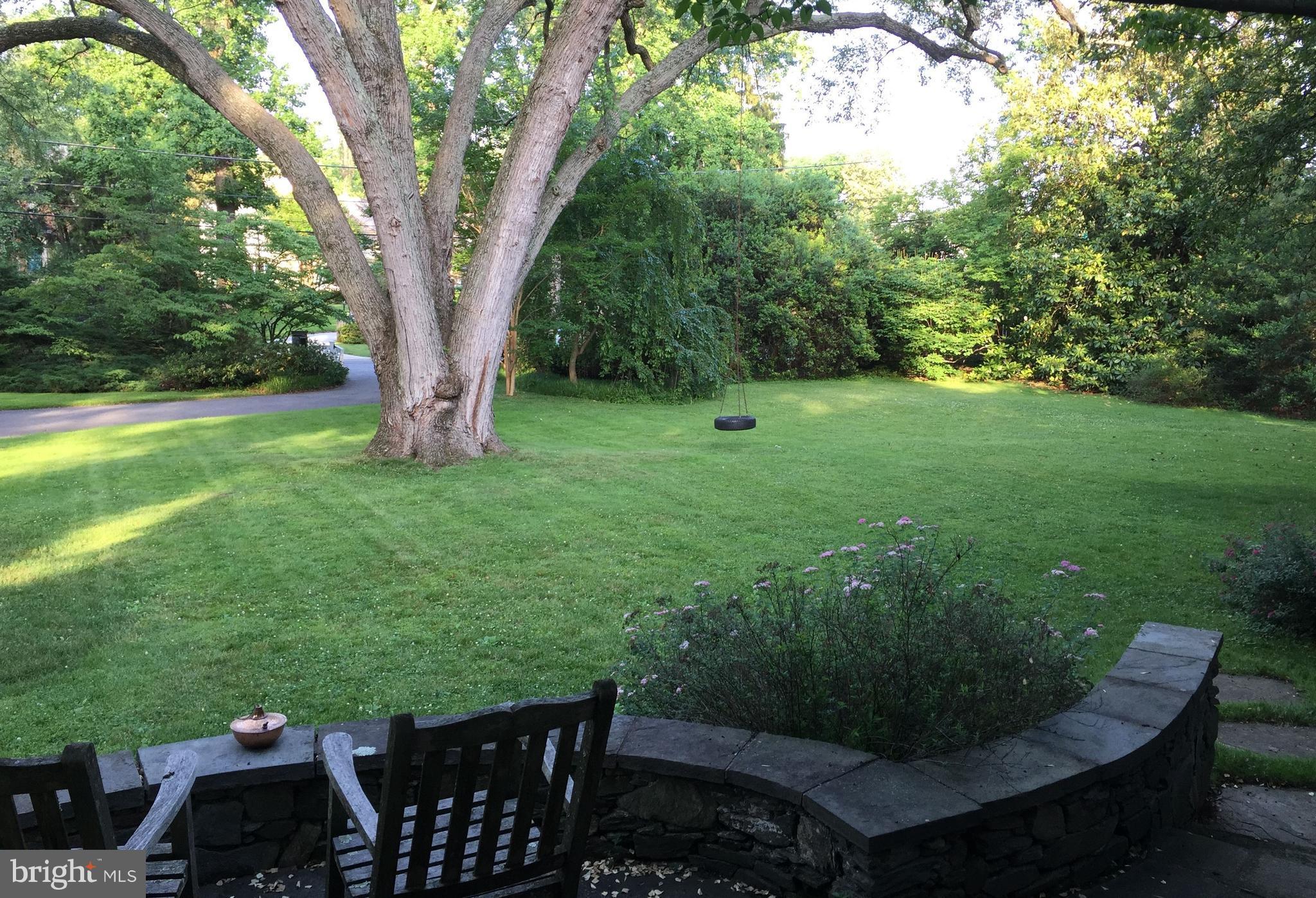 6800 Glenbrook Road Bethesda, MD 20814 - Photo 3 of 30 a view of a chairs and table in the garden