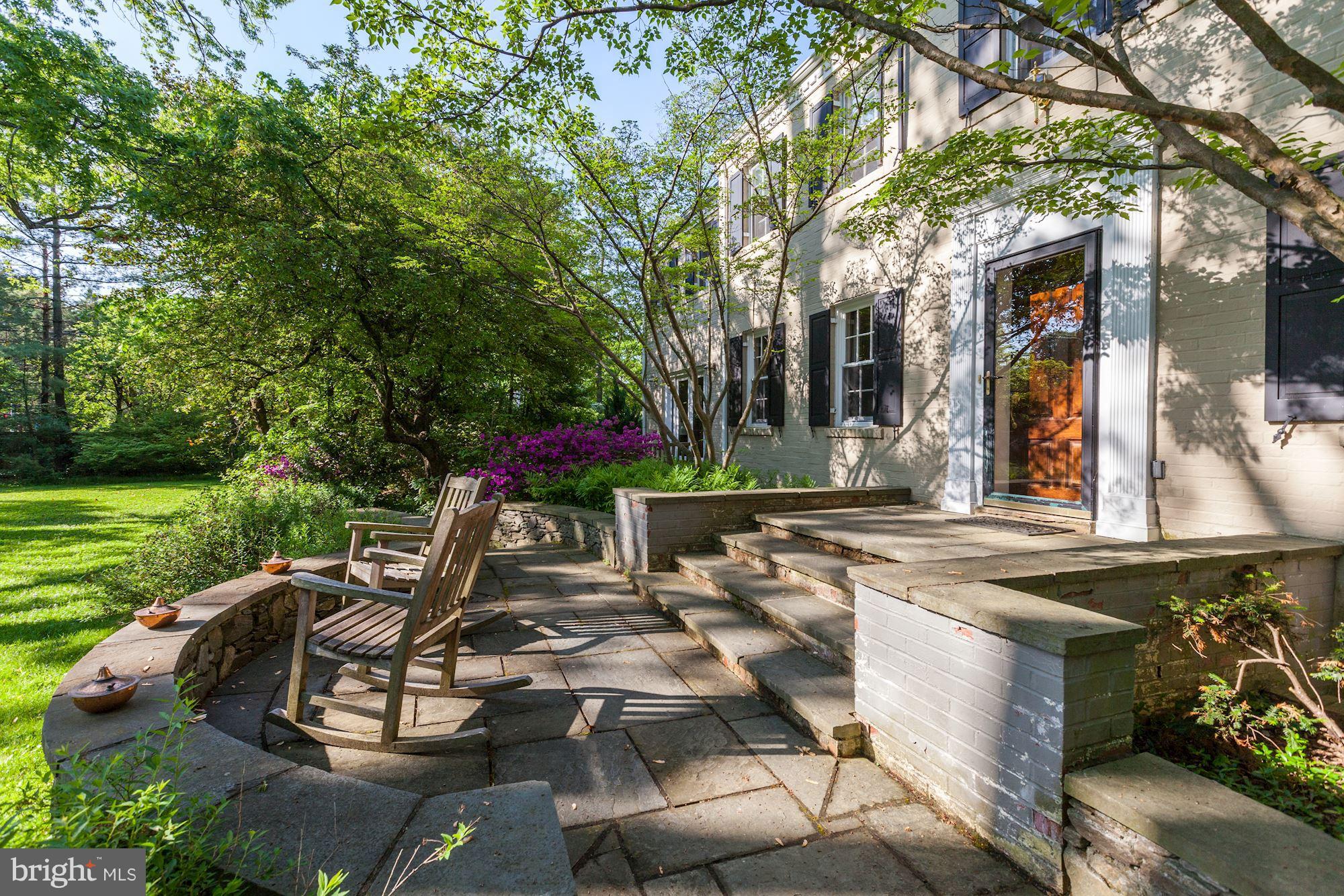 6800 Glenbrook Road Bethesda, MD 20814 - Photo 7 of 30 a view of a house with backyard sitting area and garden