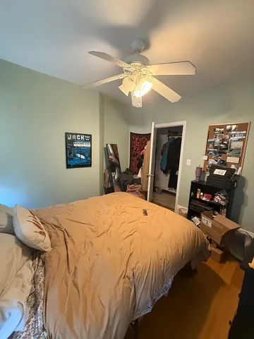 a bedroom with bed and window