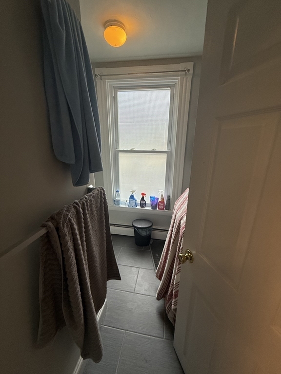 60 Walden Street, Unit 3 Cambridge, MA 02140 - Photo 7 of 12 a view of living room with furniture and a window