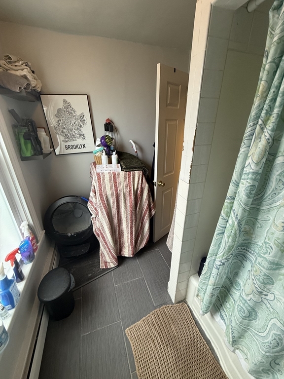 60 Walden Street, Unit 3 Cambridge, MA 02140 - Photo 10 of 12 a view of entryway and bedroom