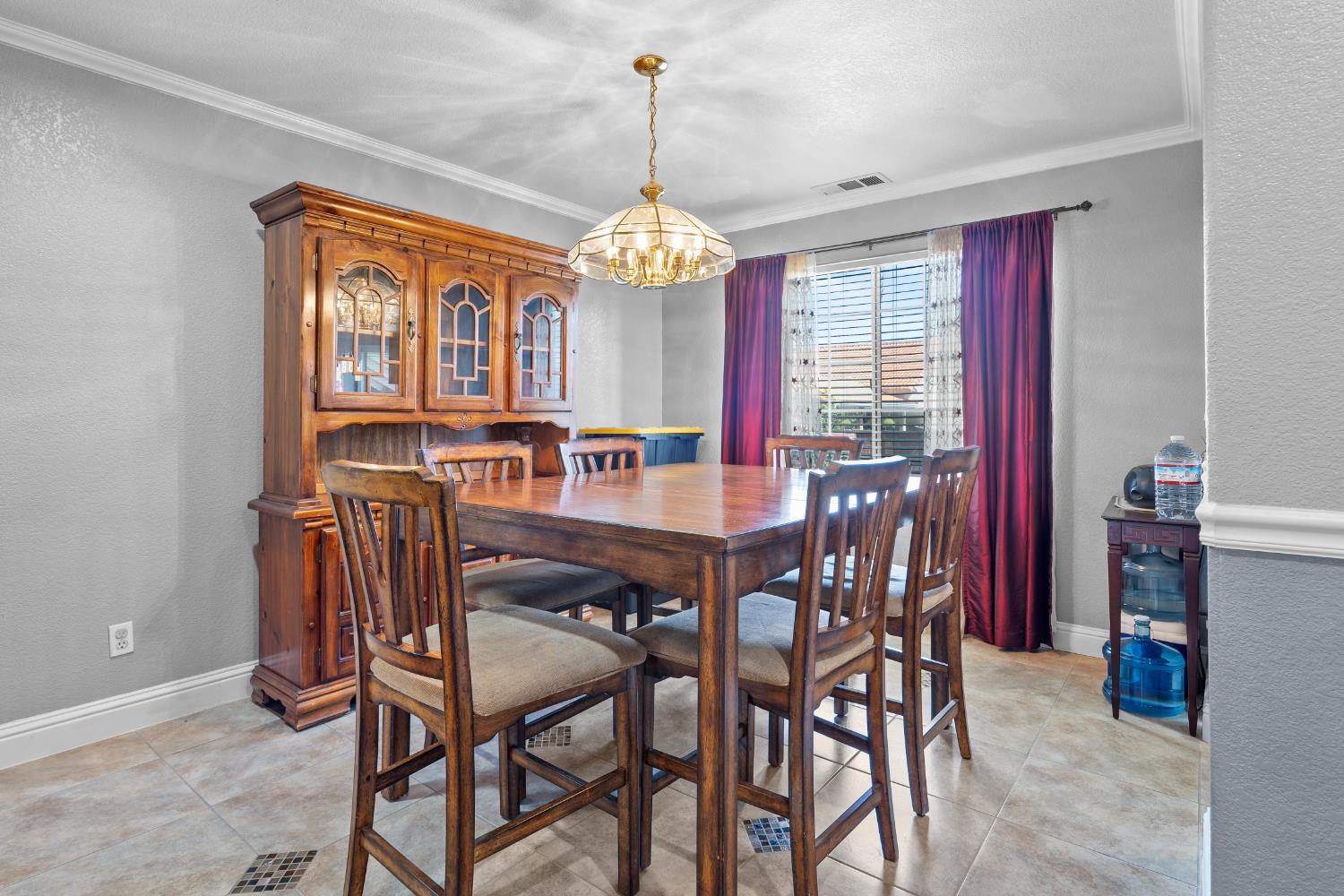 446 Port Street Los Banos, CA 93635 - Photo 11 of 55 Formal Dining Seamlessly flows with the Beautiful Custom Tile Flooring, Crown Molding & 3" Baseboards.