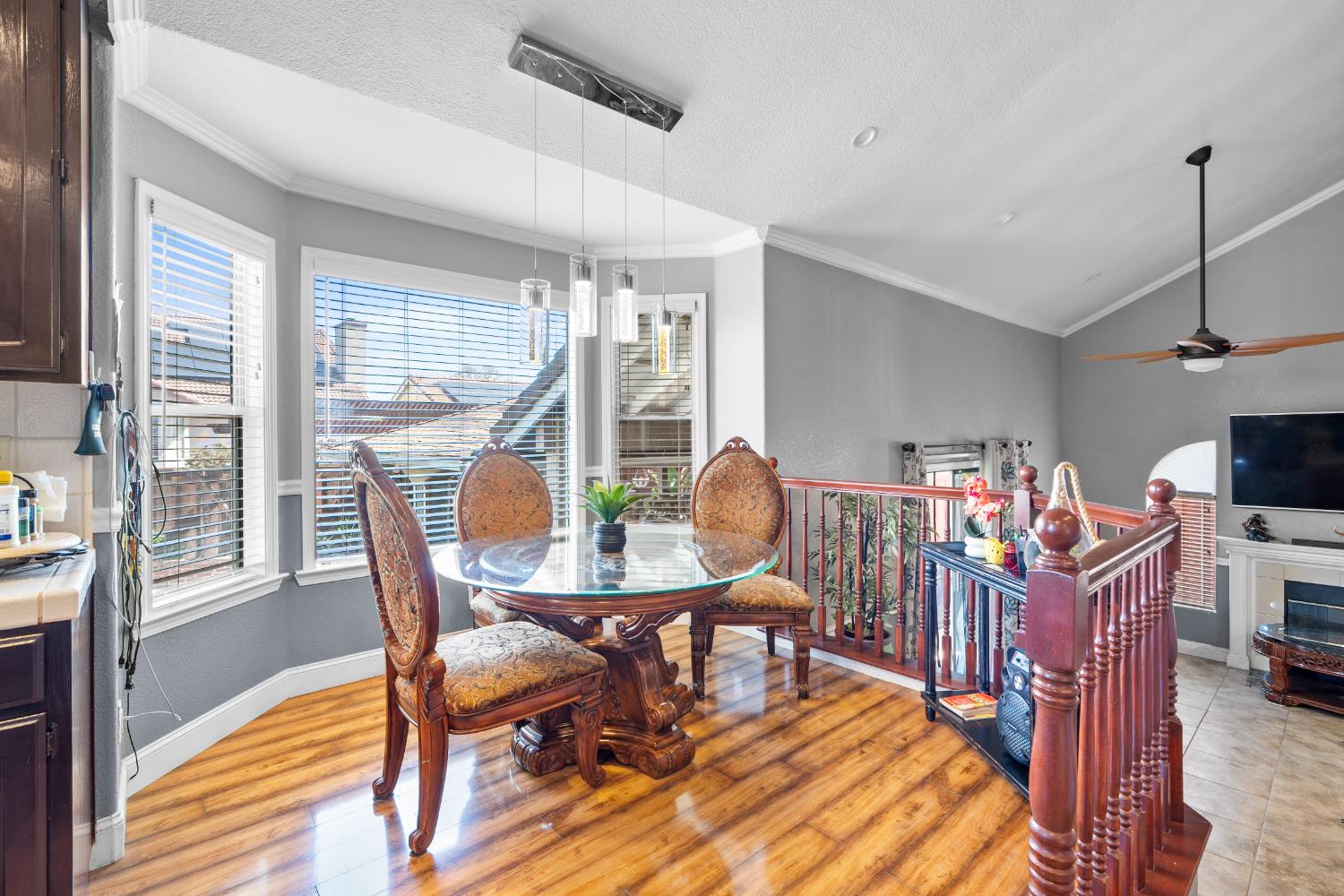 446 Port Street Los Banos, CA 93635 - Photo 16 of 55 A Beautiful Cozy Breakfast Nook adjacent to the Kitchen, perfect for Casual Dining and Everyday Living with the Elegance of Custom Lighting, Gorgeous Flooring, Crown Molding & Custom Baseboards. This Home DOES NOT disappoint!
