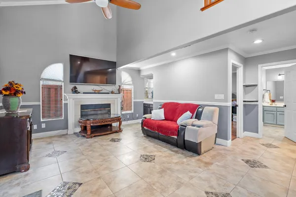 a hallway with a couch and chandelier