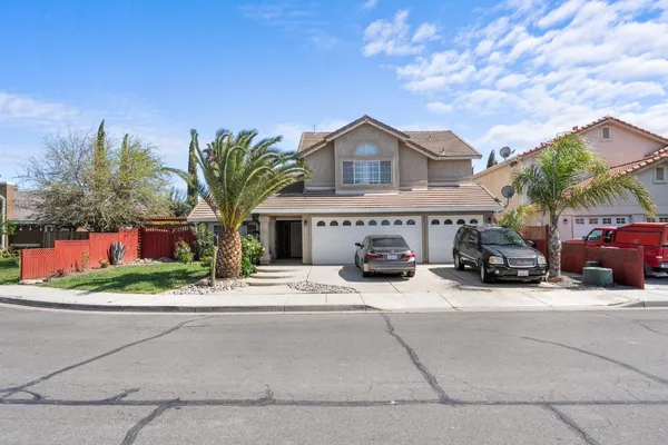 a view of car parked in front of house