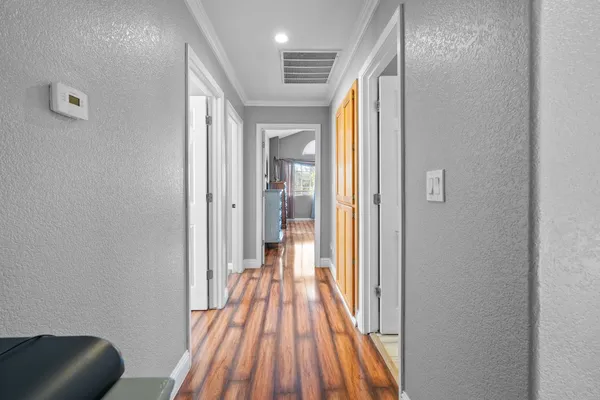 a bedroom with a bed and a ceiling fan