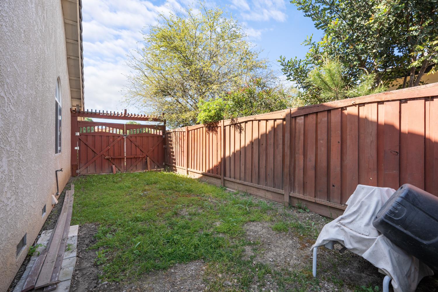 446 Port Street Los Banos, CA 93635 - Photo 53 of 55 Backyard RV/Boat Storage Parking Space with Front Yard Access.