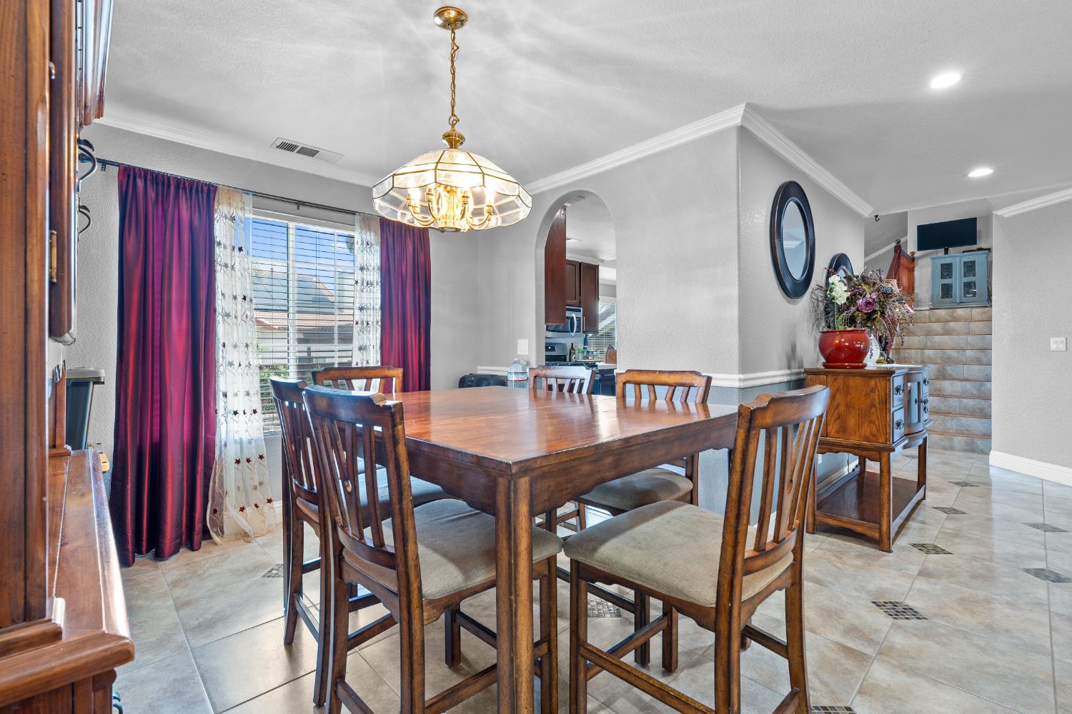 446 Port Street Los Banos, CA 93635 - Photo 10 of 55 Formal Dining Area Situated on the Landing, Ideal for Gatherings and Seamlessly Connected to the Kitchen.