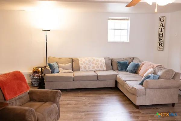 a living room with furniture and a fireplace