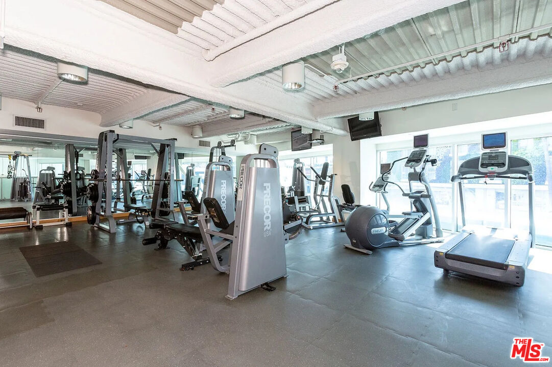 8601 Wilshire Boulevard, Unit 701 Beverly Hills, CA 90211 - Photo 11 of 14 a view of a room with gym equipment