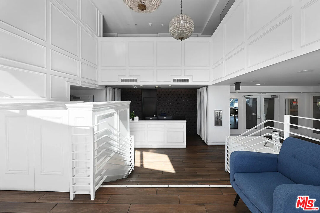 8601 Wilshire Boulevard, Unit 701 Beverly Hills, CA 90211 - Photo 13 of 14 a living room with furniture and kitchen view