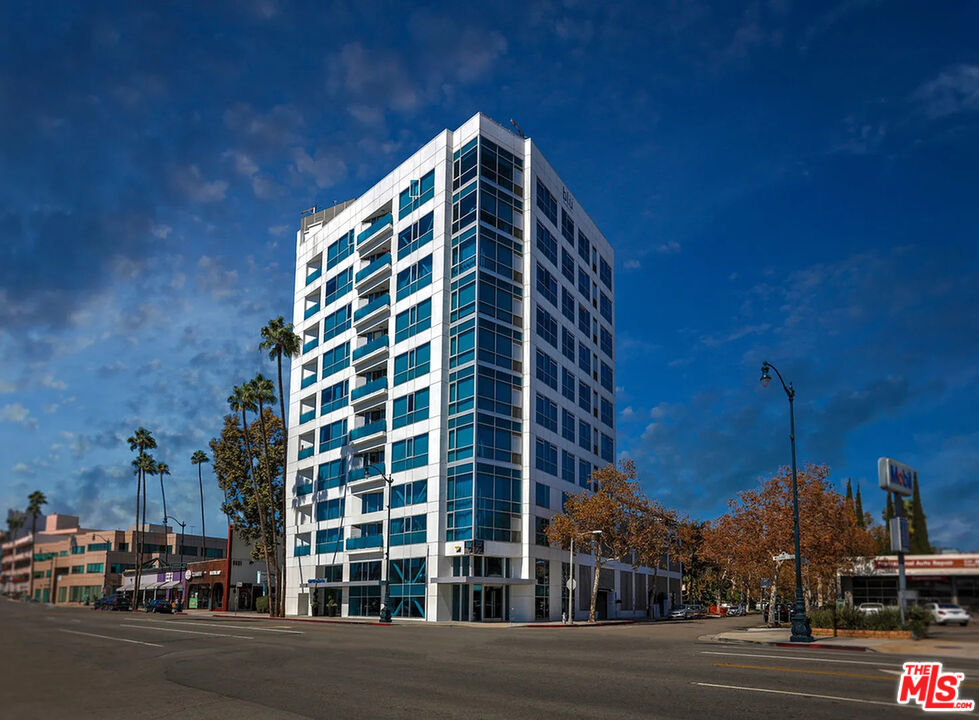 8601 Wilshire Boulevard, Unit 701 Beverly Hills, CA 90211 - Photo 14 of 14 a view of a tall building next to a road