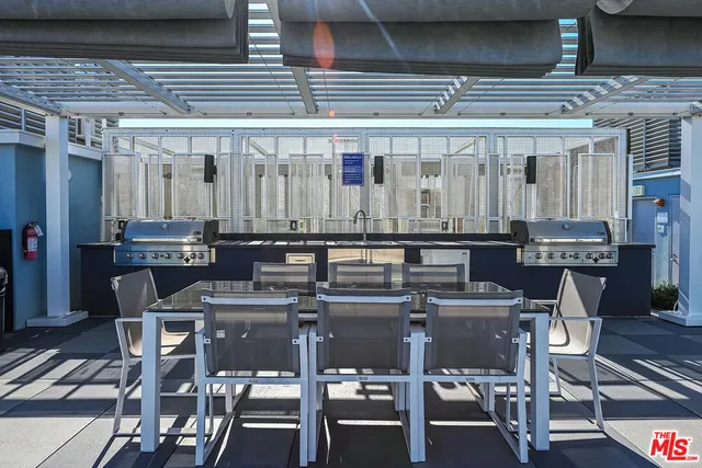 a kitchen with a table and chairs