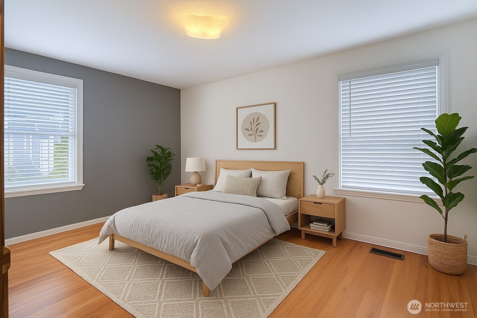 2723 Locust Avenue West University Place, WA 98466 - Photo 4 of 15 a bedroom with a bed and a potted plant