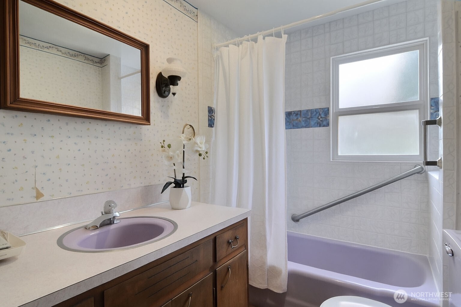 2723 Locust Avenue West University Place, WA 98466 - Photo 5 of 15 a bathroom with a sink and a mirror
