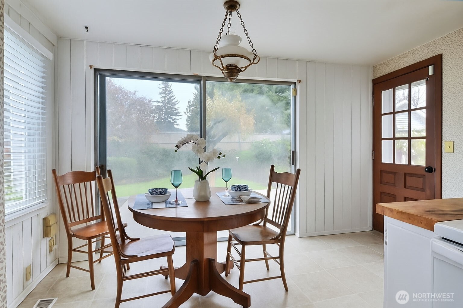 2723 Locust Avenue West University Place, WA 98466 - Photo 9 of 15 a view of a dining room with furniture window and outside view