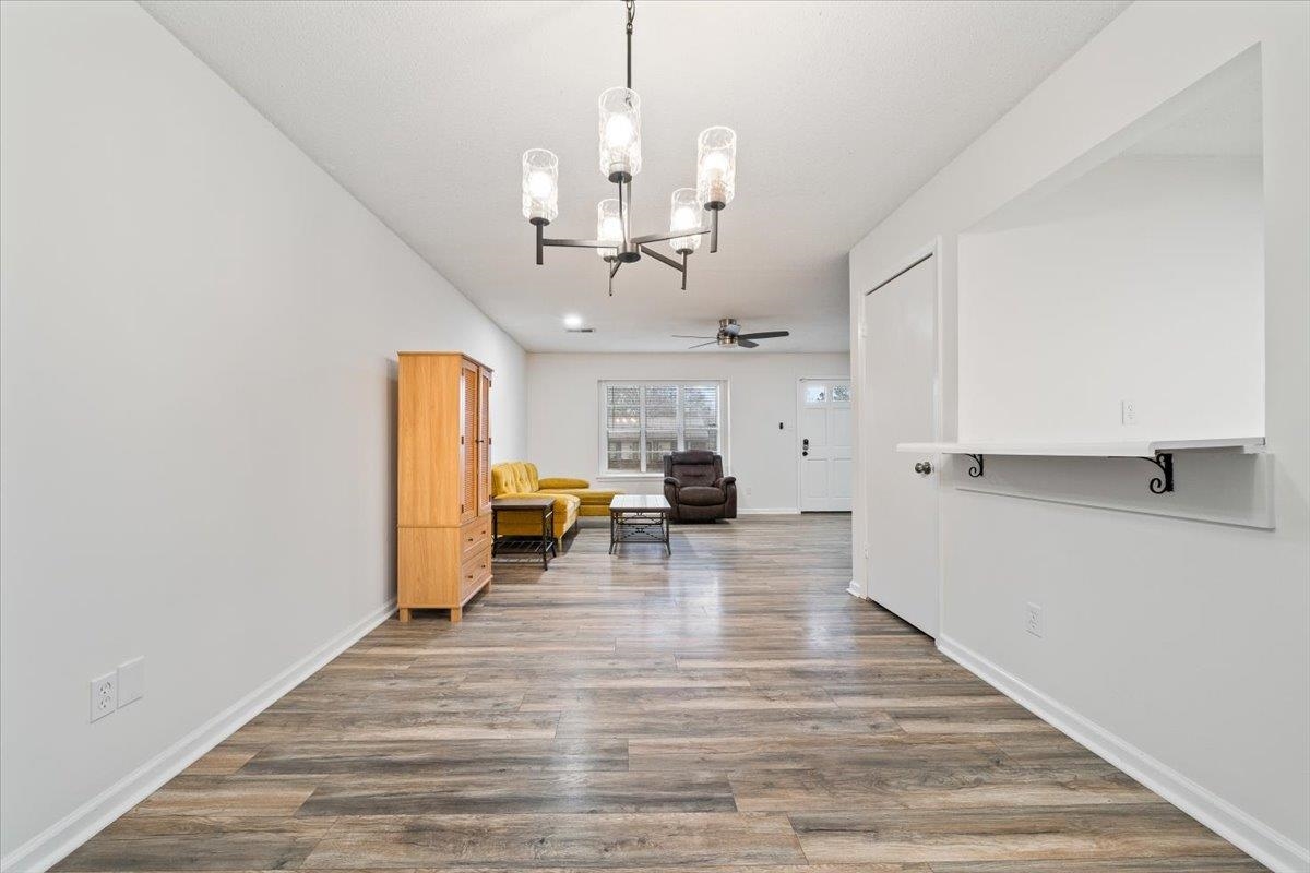 947 Hunters Retreat Drive Collierville, TN 38017 - Photo 6 of 27 Dining room featuring wood finished floors, and new chandelier