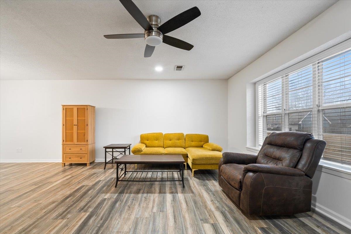 947 Hunters Retreat Drive Collierville, TN 38017 - Photo 7 of 27 a living room with furniture and a wooden floor