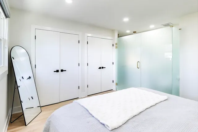 a bathroom with a sink mirror and vanity