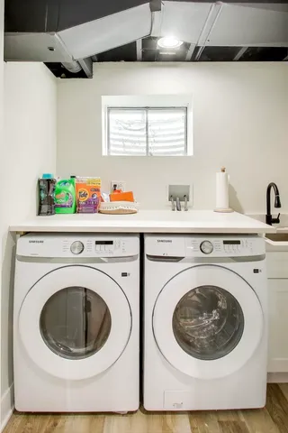 a front view of a house with iron fence