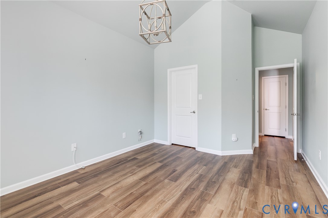 7538 South Franklins Way Quinton, VA 23141 - Photo 31 of 48 a view of a room with wooden floor and white walls