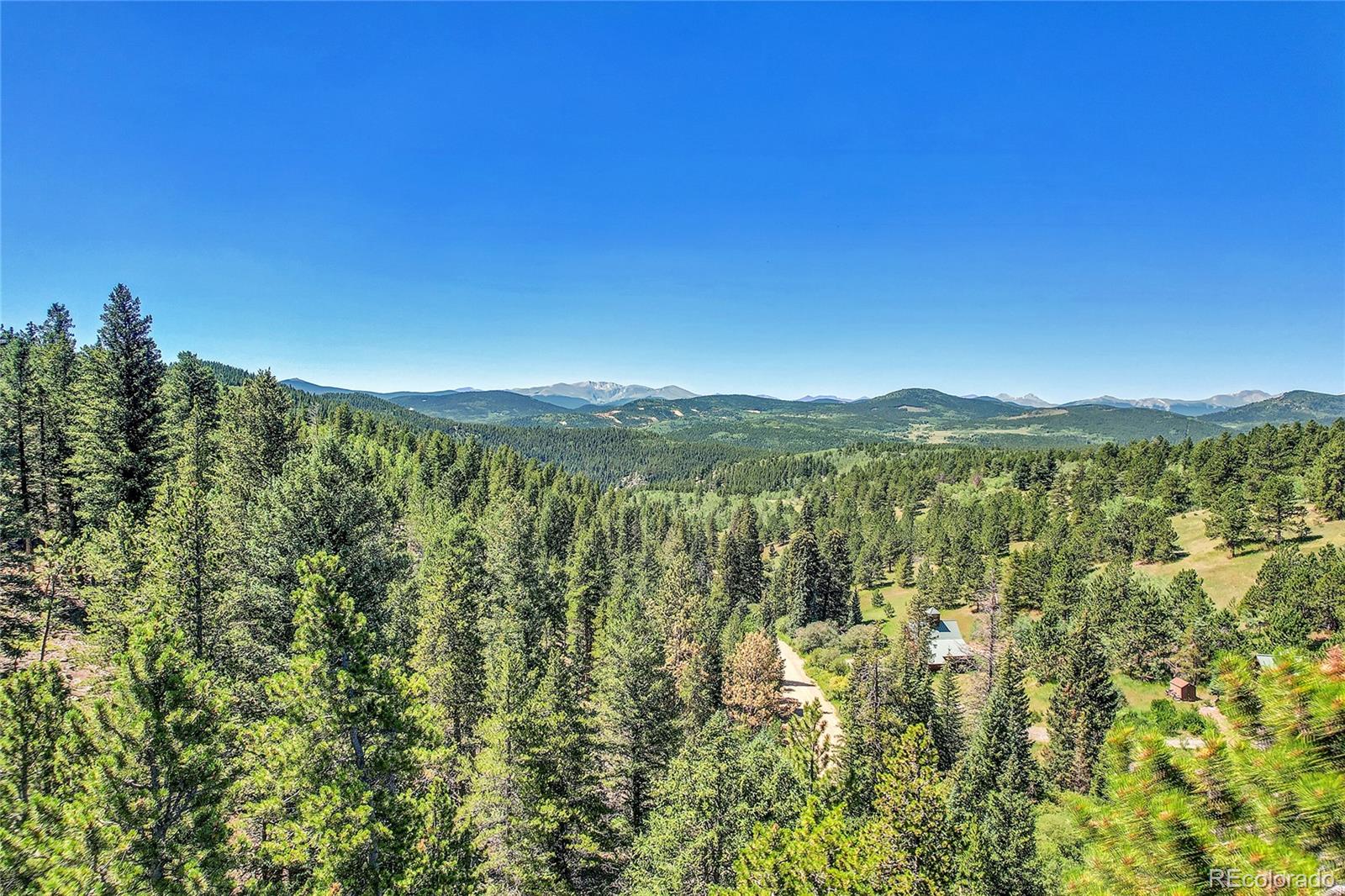 5 Hughesville Road Black Hawk, CO 80422 - Photo 4 of 17 a view of a city with lush green forest
