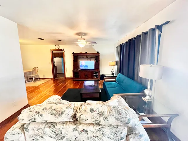 a bedroom with a bed window and couch