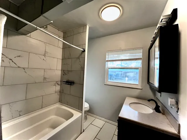 a bathroom with a sink and a bathtub