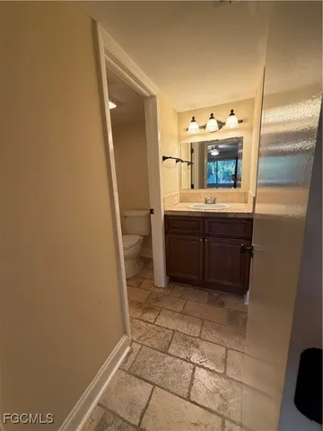 a bathroom with a shower and a toilet