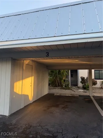 a view of a chairs and table in the balcony