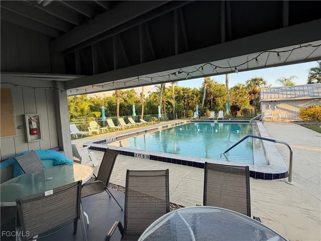 swimming pool view with a garden space