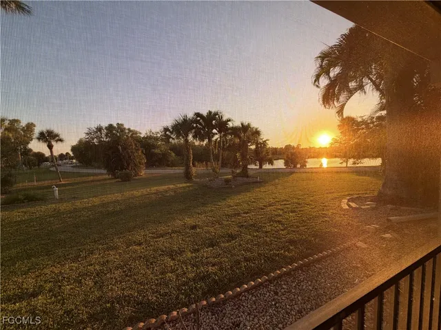 a kitchen with a sink a stove and cabinets
