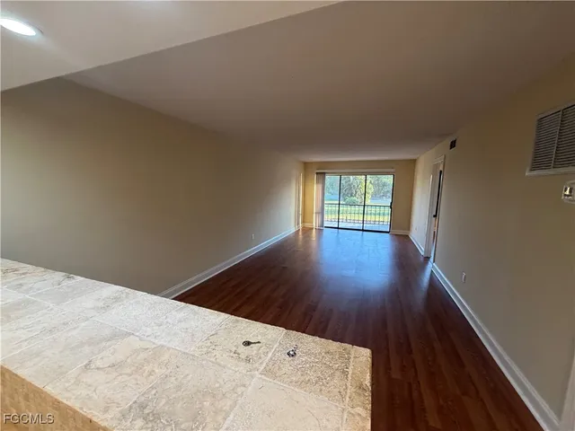 a kitchen with a sink and stainless steel appliances