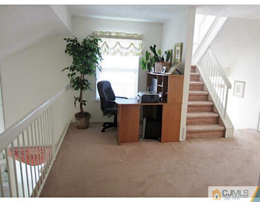 375 Draco Road Piscataway, NJ 08854 - Photo 14 of 25 a view of a workspace with furniture and a window