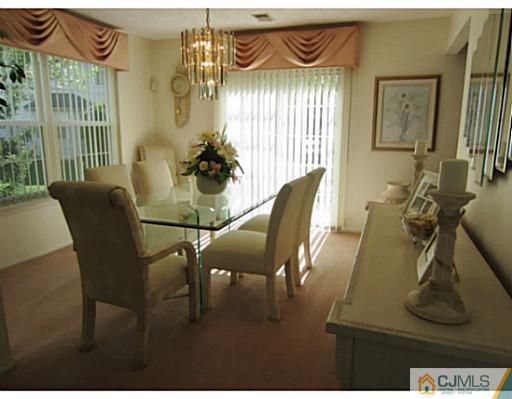 375 Draco Road Piscataway, NJ 08854 - Photo 9 of 25 a view of a dining room with furniture and wooden floor