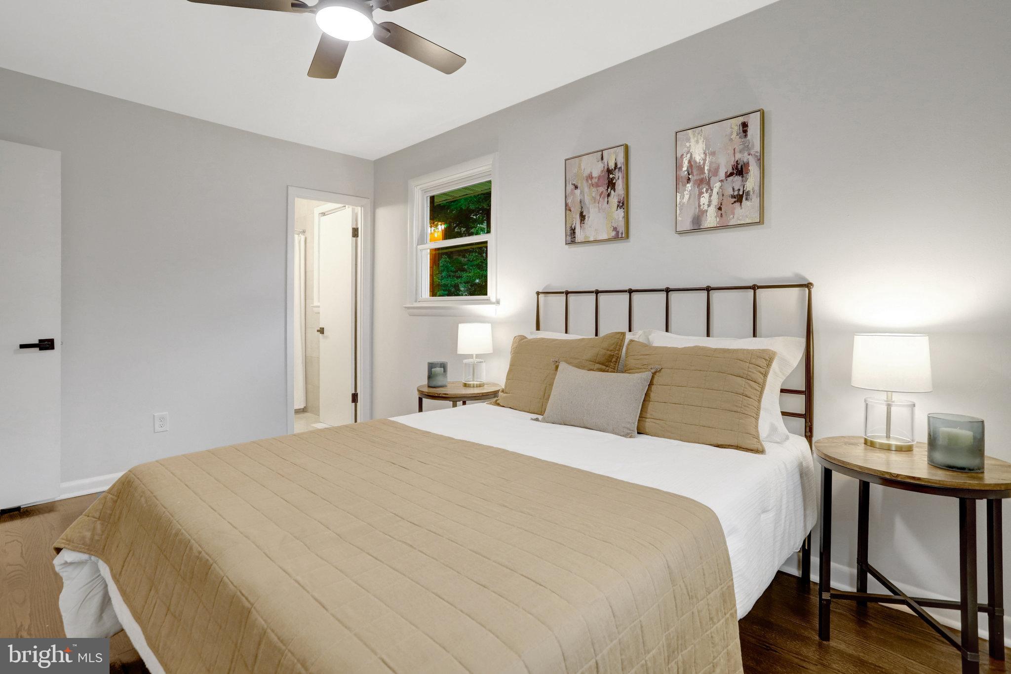 4206 16th Road South Arlington, VA 22204 - Photo 13 of 35 a bed room with a bed and a chandelier