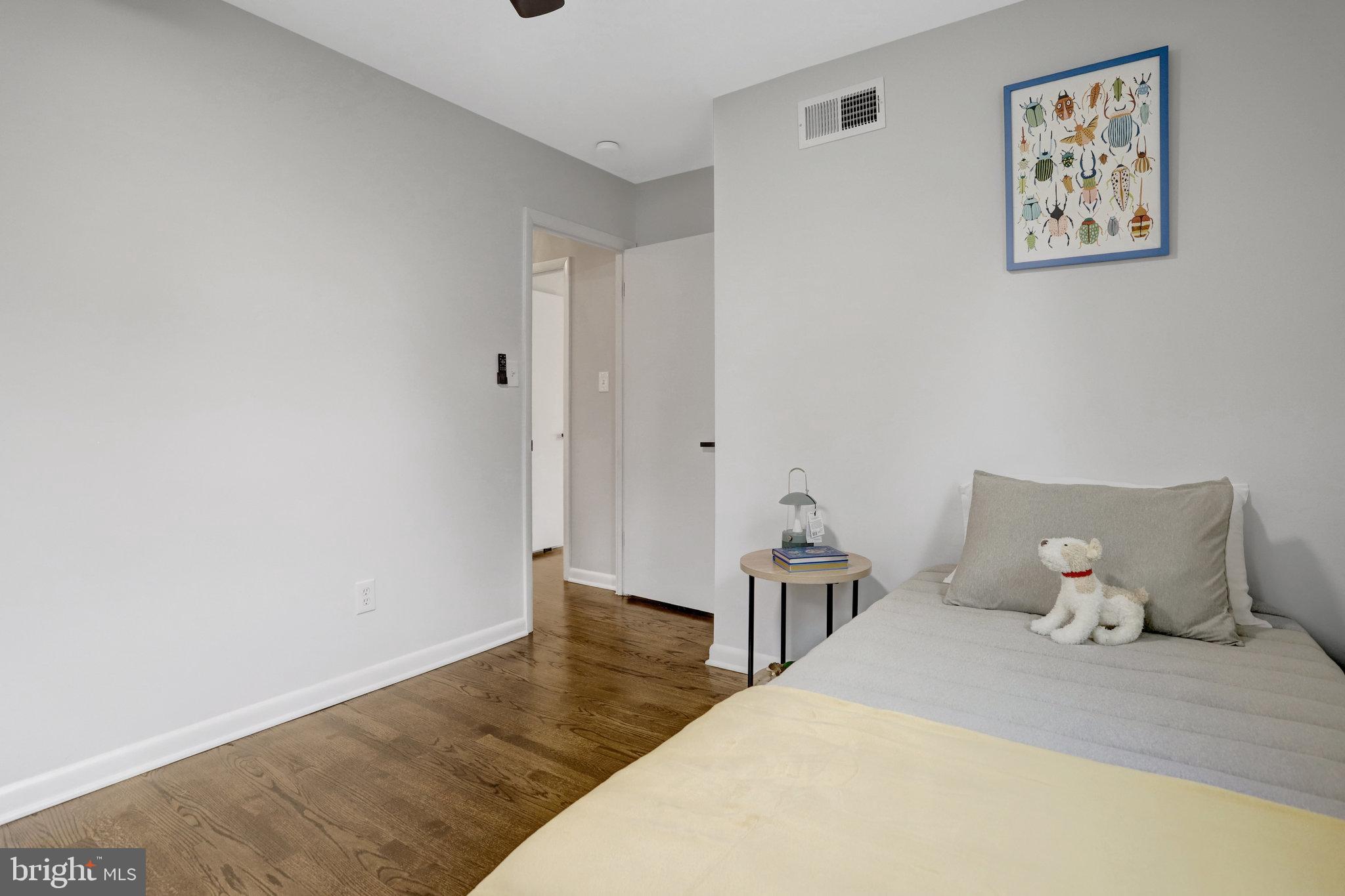 4206 16th Road South Arlington, VA 22204 - Photo 17 of 35 a bedroom with a bed and painting on the wall