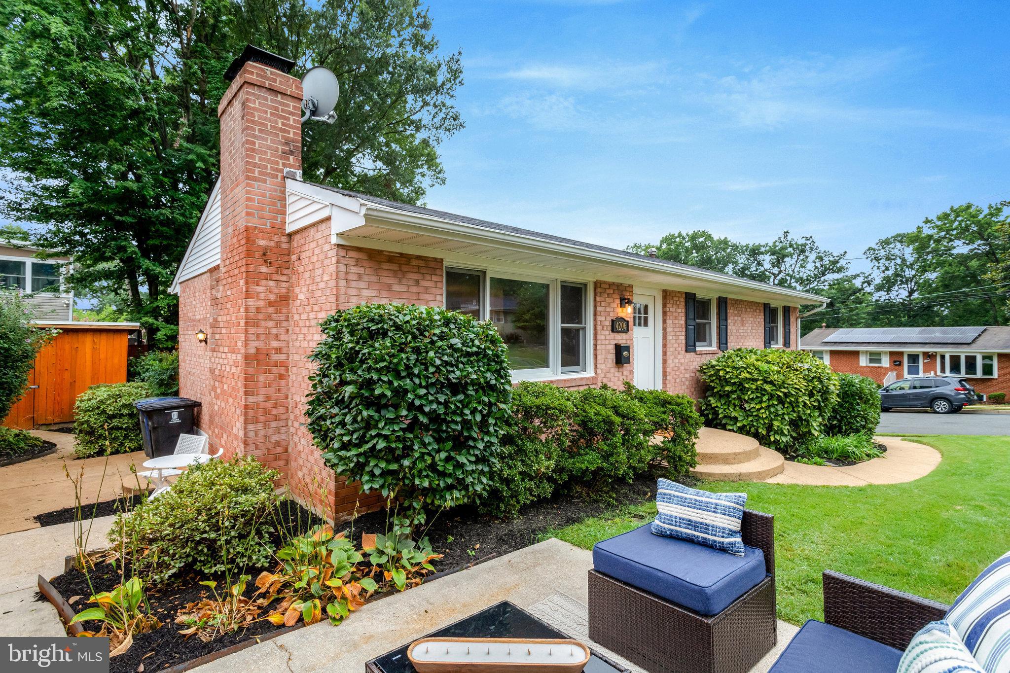4206 16th Road South Arlington, VA 22204 - Photo 2 of 35 a view of a house with a yard and sitting area
