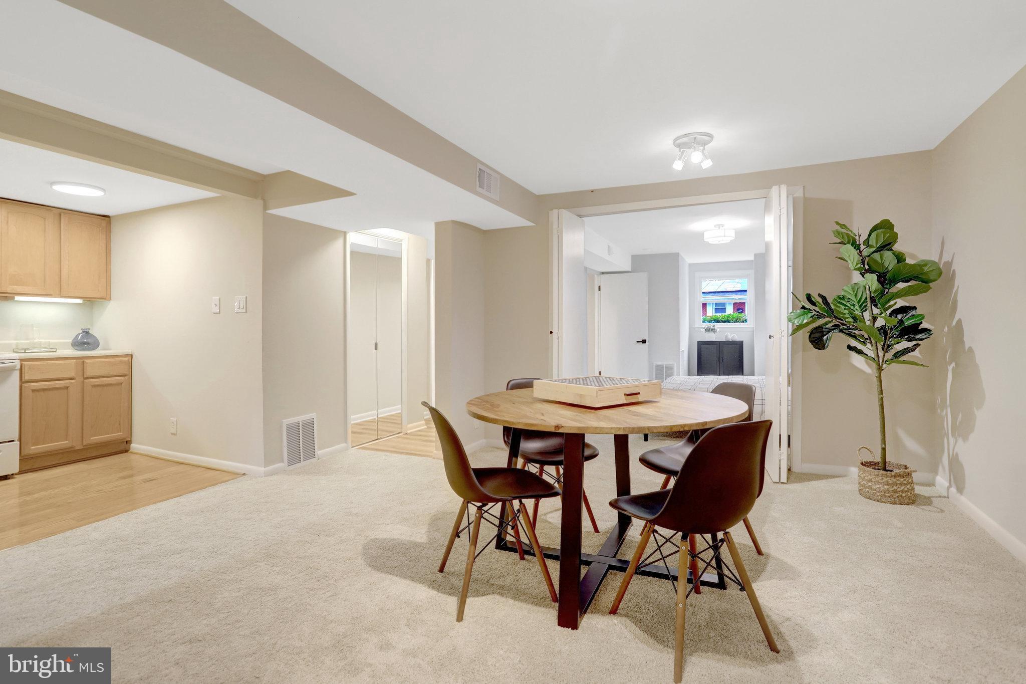 4206 16th Road South Arlington, VA 22204 - Photo 24 of 35 a view of a dining room with furniture and a potted plant